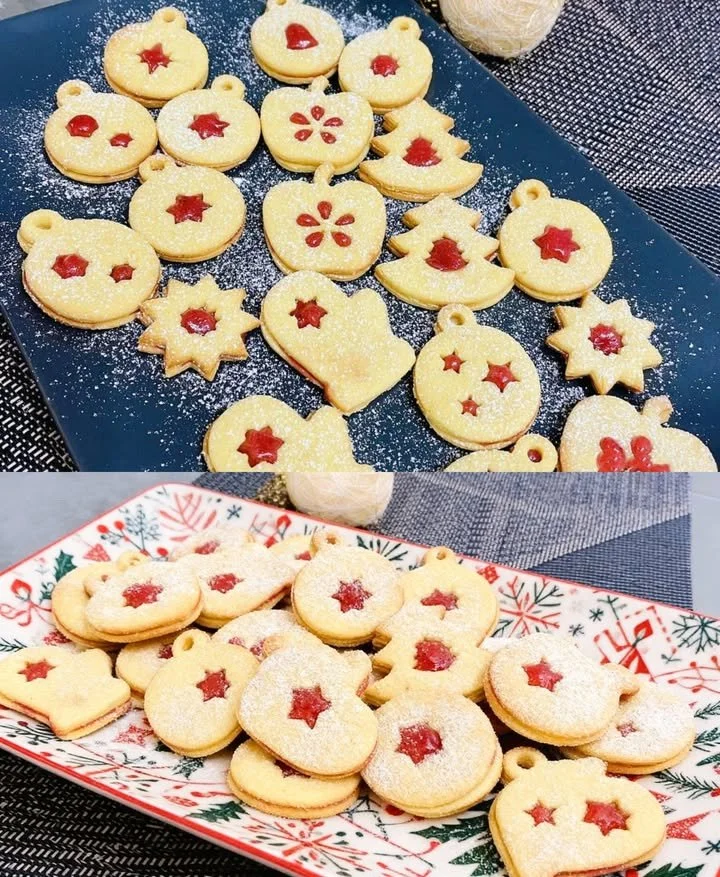 Linzer-Plätzchen mit Marmelade und Nüssen auf einem Teller