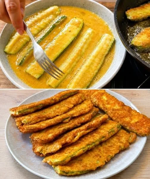 Panierte Zucchini Scheiben goldbraun und knusprig angerichtet auf einem Teller