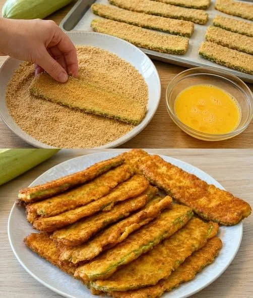 Panierte Zucchini Scheiben mit Parmesan auf einem Teller serviert